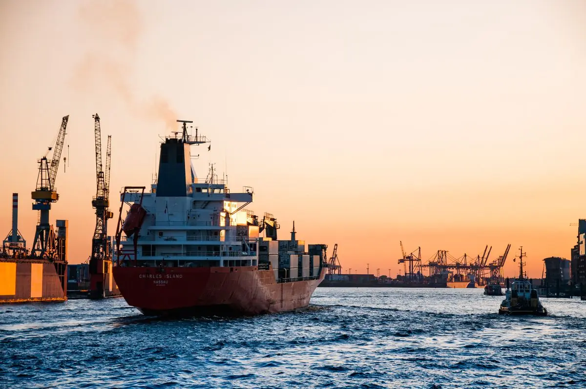 Cargo ship and cranes at a commercial port
